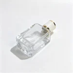 50ml beveled rectangular perfume bottle lying on its side, displaying the bottle base and lower body structure from a bottom-facing angle.