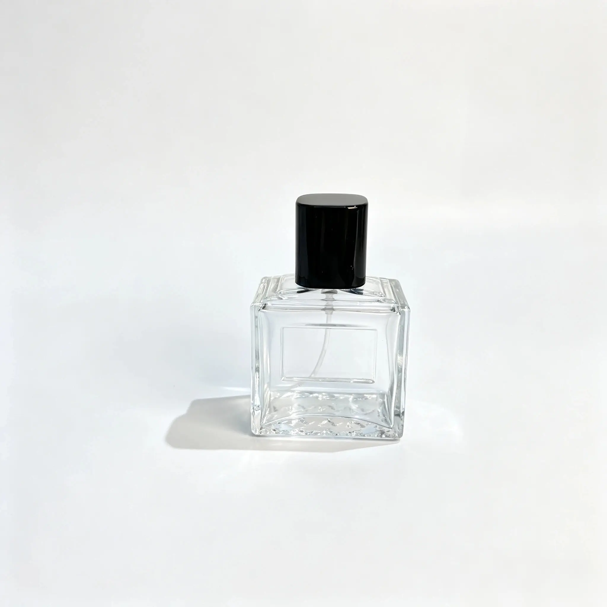 50ml Embossed Frame Perfume Bottle Front View 50ml embossed frame perfume bottle shown from the front with a raised square profile and glossy black cap