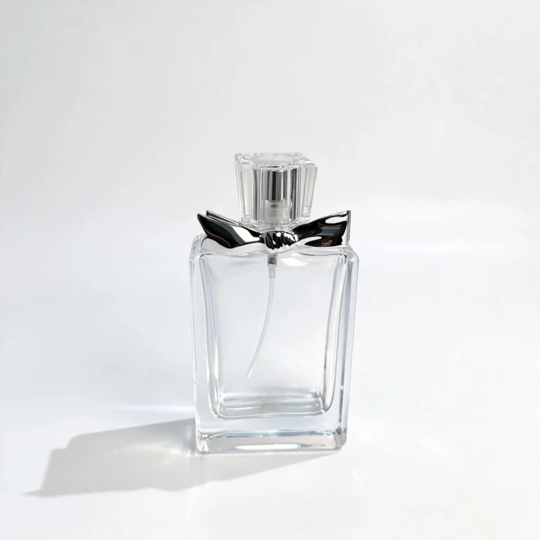 Front view of a 50ml flat rectangular perfume bottle with decorative bow detailing, showing the assembled bottle and cap.
