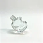 5ml apple-shaped glass nail polish bottle shown without the cap and brush assembly