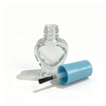 5ml glass nail polish bottle displayed with its cap and brush components separated for packaging and component evaluation