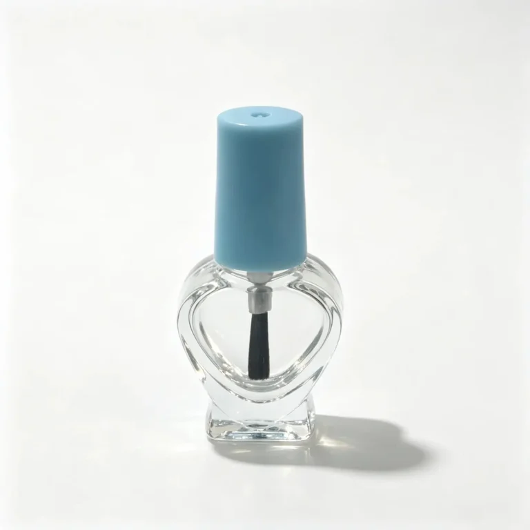 5ml heart-shaped glass nail polish bottle shown from the front with a light blue cap and visible brush assembly