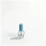 Side profile of the 5ml heart-shaped glass nail polish bottle showing the compact glass body contour and cap proportion