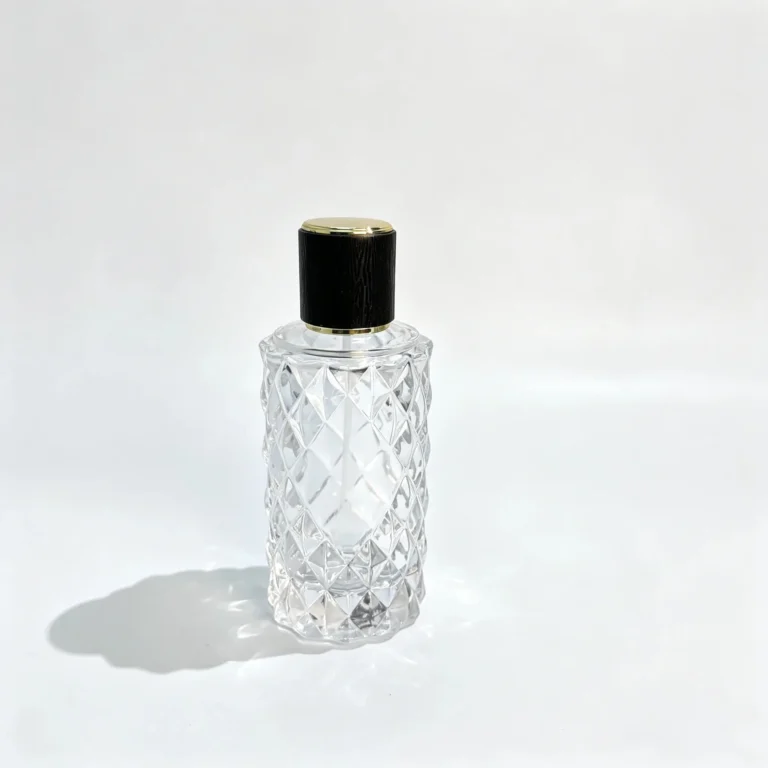 Front view of the 80ml diamond-faceted perfume bottle with its decorative cap and geometric bottle body for fragrance packaging.