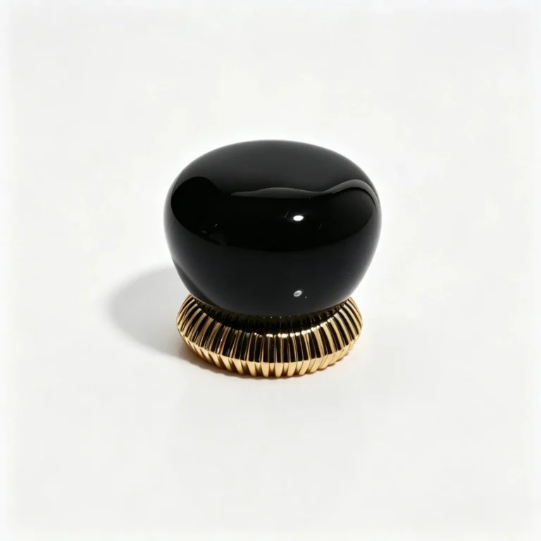 Black pebble-shaped resin perfume cap shown from the front with vertical ribbed detailing and an irregular rounded profile for fragrance packaging