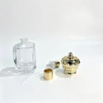 30ml Crown Diamond perfume bottle displayed alongside its spray pump, dip tube and decorative cap for fragrance packaging component evaluation.