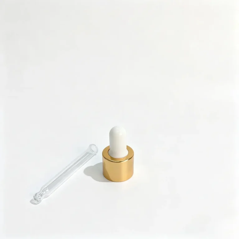 Gold aluminum collar glass dropper shown with the white rubber bulb closure separated from the transparent glass pipette component