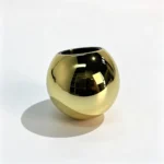 Gold round ABS perfume cap positioned with the lower press-on opening facing upward to show the cap opening and closure profile