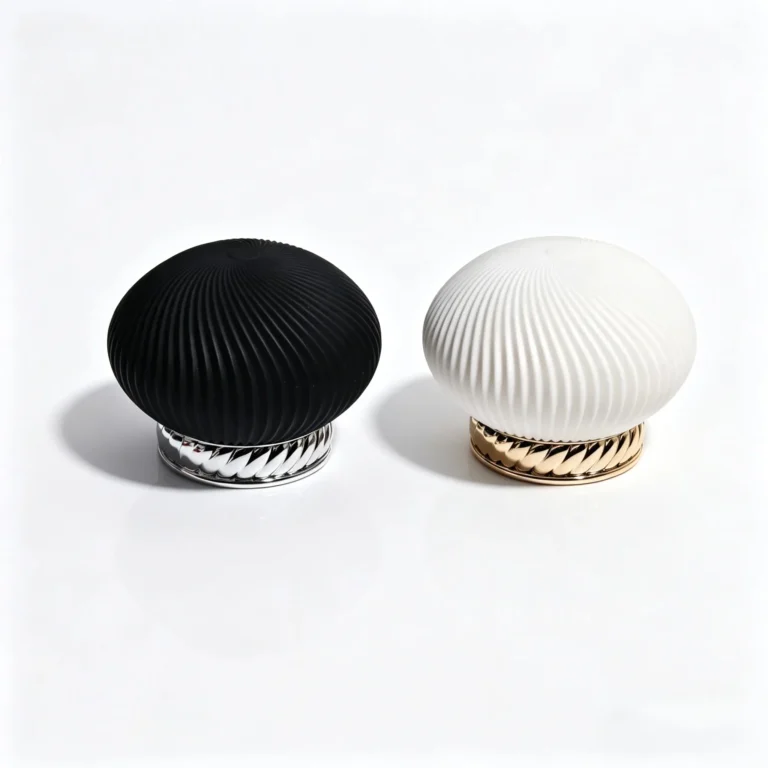 Oval ABS and zinc alloy perfume cap shown from the front with a spiral vertical-ribbed exterior for fragrance packaging
